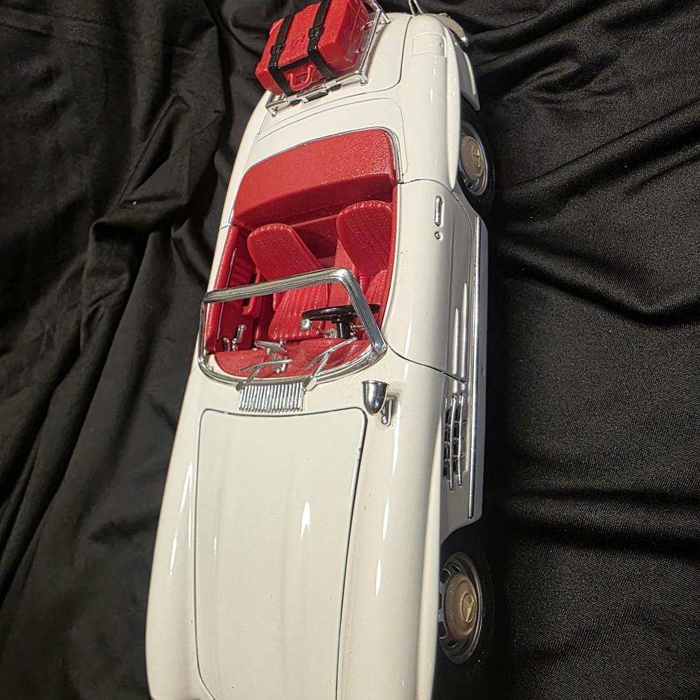White Convertible Model Car with Red Interior